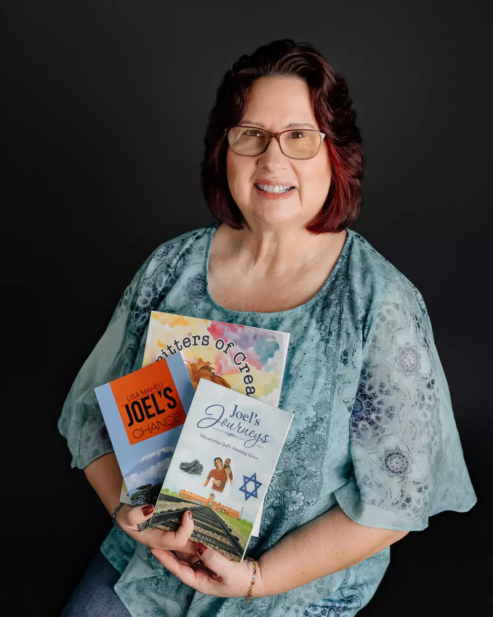 Lisa sitting with books